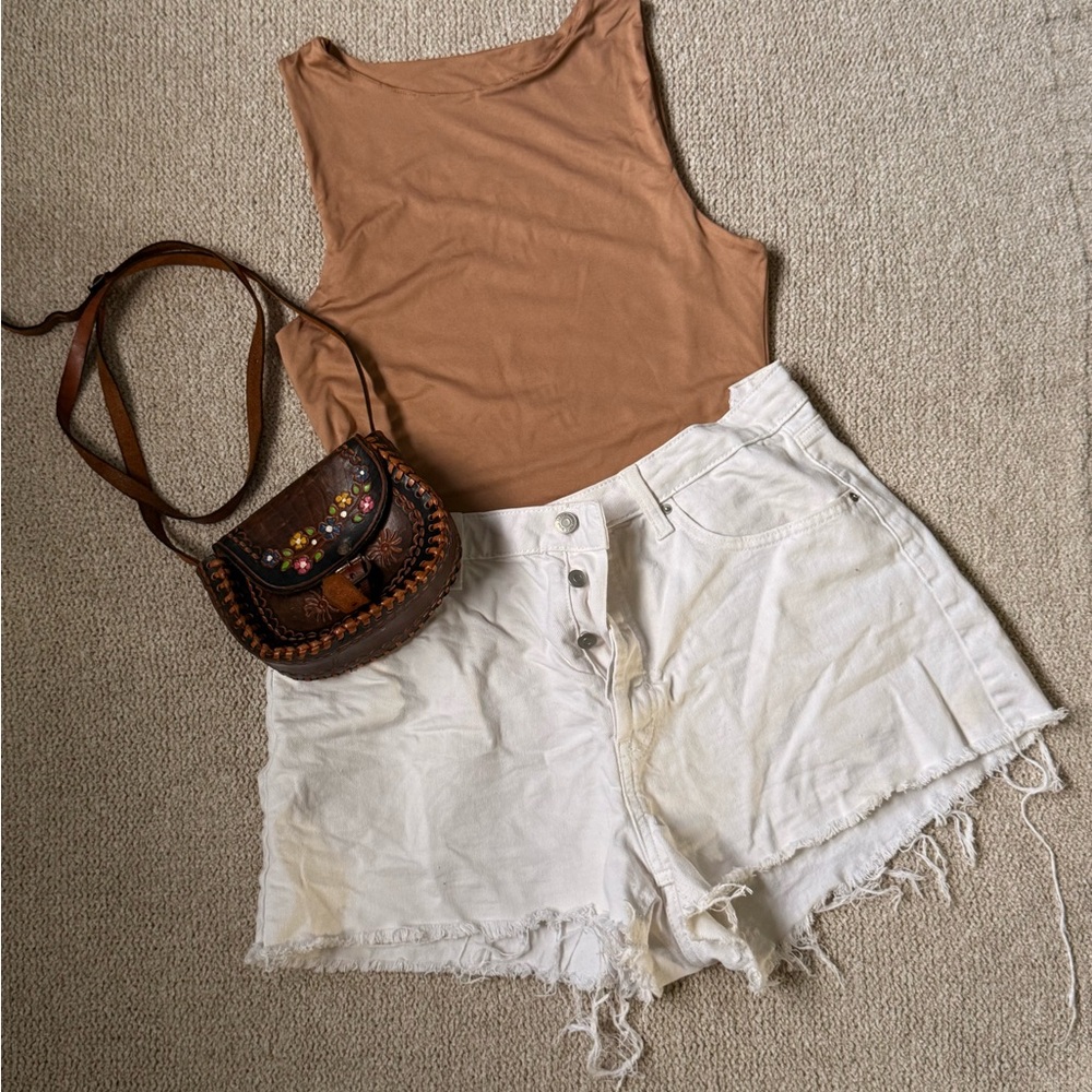 Nude Body Suit and White Distressed Shorts with Brown Embroidered Bag